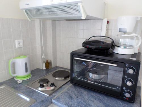 Η κουζίνα ή μικρή κουζίνα στο Asfodelos Apartment Hotel
