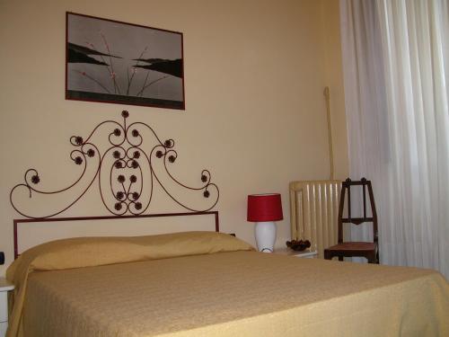 Кровать или кровати в номере Villa Patrizia B&B