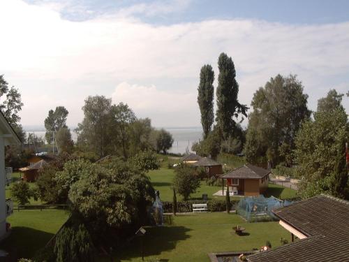 a view of a park with trees and houses at Studio direkt am Bodensee in Thal