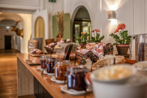a kitchen counter with jars of food on it at Hotel Seehof-Arosa in Arosa