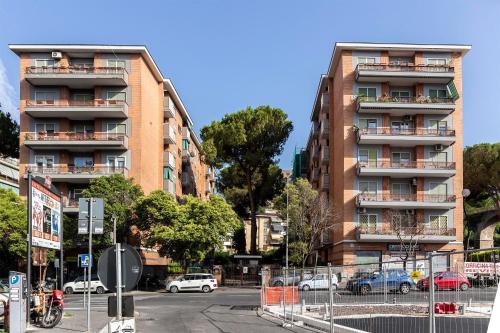 a tall building with cars parked in front of it at Dulcis In Vatican b&b in Rome