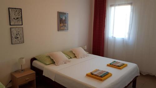 Giường trong phòng chung tại Apartments Vera - Mirca