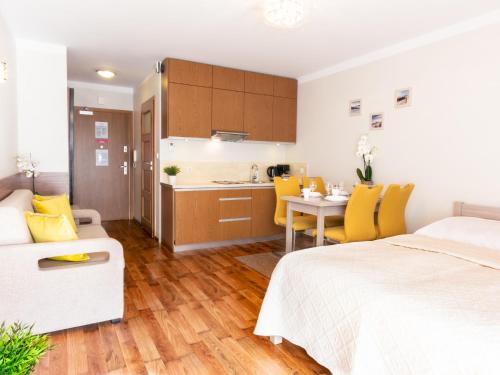 Ένα ή περισσότερα κρεβάτια σε δωμάτιο στο VacationClub - Villa Mistral Apartment 13