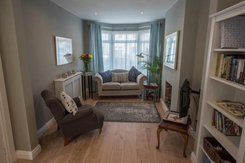 a living room with two chairs and a couch at Ninety Seven in Holywood