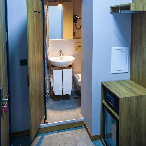 a small bathroom with a sink and a toilet at Jurnal Hotel in Istanbul