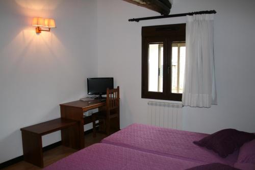 เตียงในห้องที่ Hotel Rural San Millán