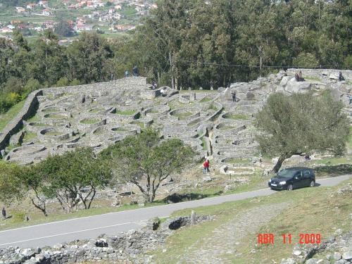 a car is driving down a road on a hill at Hotel Vila da Guarda in A Guarda