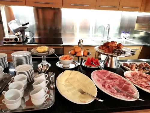 a kitchen with many plates of food on a counter at Locanda della Maria in Bellagio