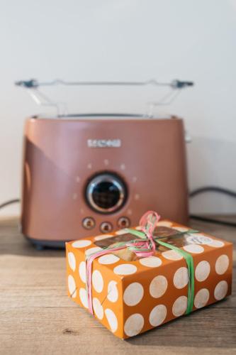 a gift box sitting next to a camera at KaksTeist Apartments in Haapsalu