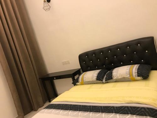 Postel nebo postele na pokoji v ubytování Arsyad Homestay Changlun