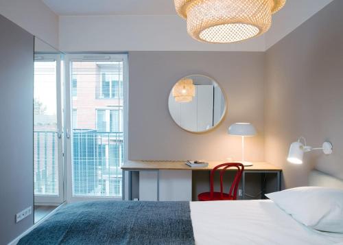 Un pat sau paturi într-o cameră la TJB Design Apartment RAJSKA 8