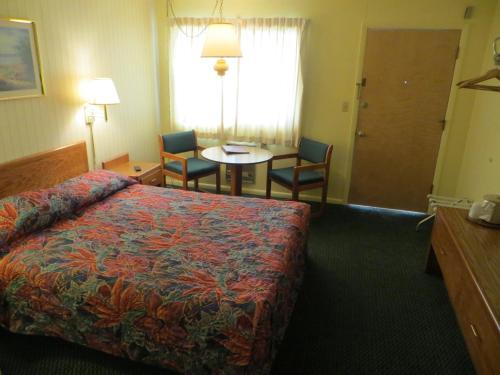 Ένα ή περισσότερα κρεβάτια σε δωμάτιο στο Starlite Budget Inn