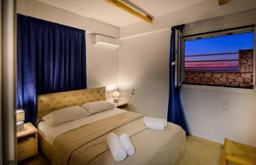 Posteľ alebo postele v izbe v ubytovaní Rontos House, seaside