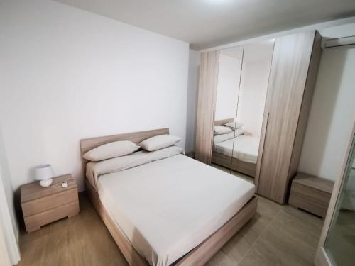 Łóżko lub łóżka w pokoju w obiekcie Case al castello