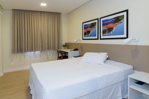 Uma cama ou camas num quarto em Hotel Domani
