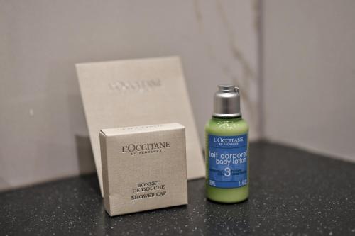 a bottle of iodine next to a box on a table at Pod Zidom Rooms in Zagreb