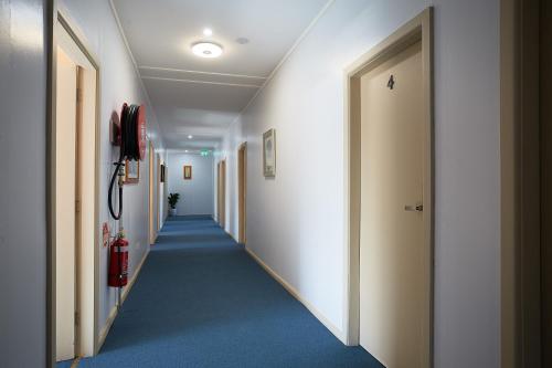 a hallway of a hospital with a hallway at iMotel Cooma (in town) in Cooma