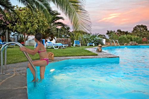 a young girl in a bikini exiting a swimming pool at Monte Do Caneiro in Mourão
