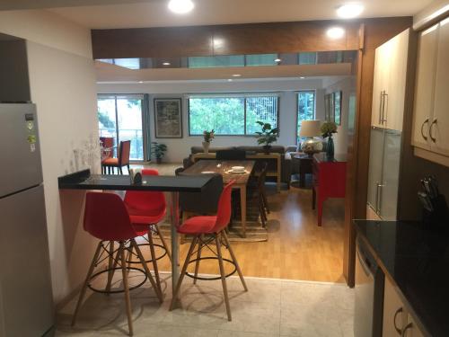 a kitchen and living room with a table and chairs at Best location in Mexico City in Mexico City