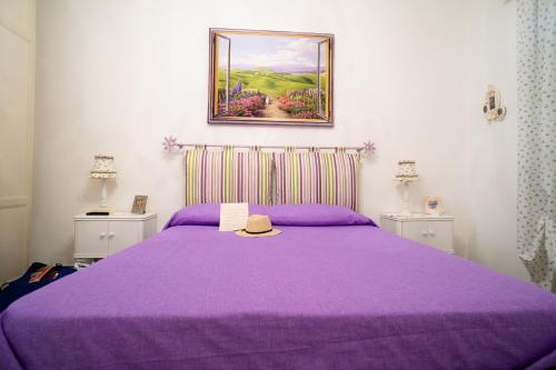 
A bed or beds in a room at A Casa di Nonna Ada
