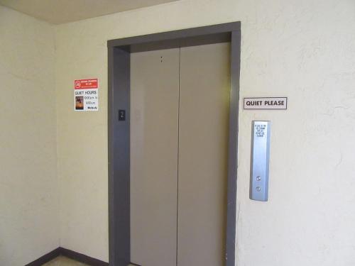 a elevator door with a sign that reads unit passes at Perfect for families and couples - Maui Sunset A-203 in Kihei