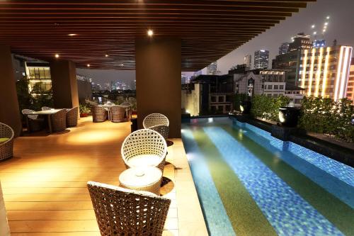 a swimming pool on the roof of a building at AONE Hotel in Jakarta