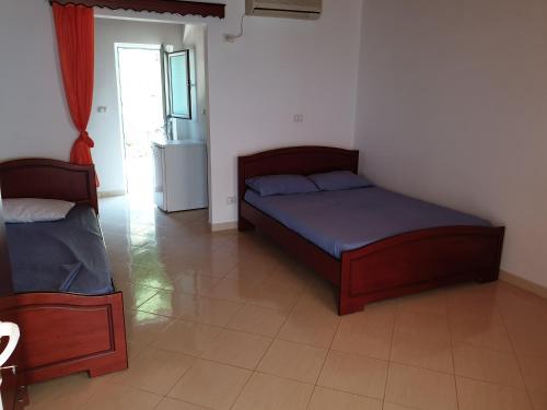 מיטה או מיטות בחדר ב-Vila Gusti