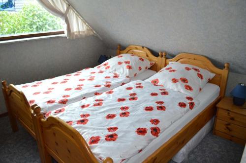 Tempat tidur dalam kamar di Ferienhaus Mühlenberg