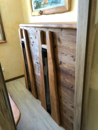 a row of wooden bookshelves in a room at Landgasthof Rebstock in Ottenhöfen