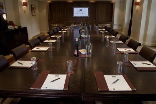 a large conference room with a long table with chairs at Balbirnie House Hotel in Glenrothes