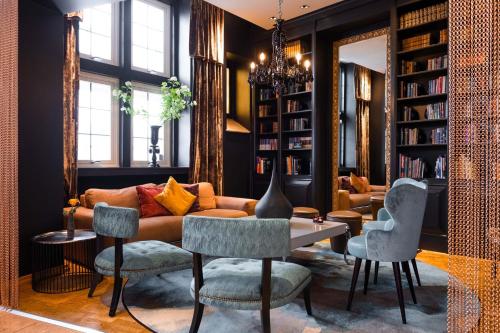 a living room with a couch and chairs at Clarion Collection Hotel Havnekontoret in Bergen