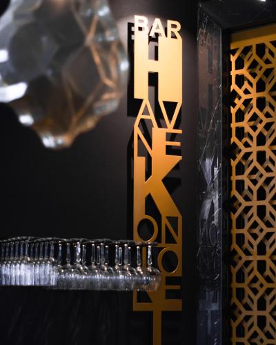 a sign for per kiss cosmetics is shown at a store at Home Hotel Havnekontoret in Bergen