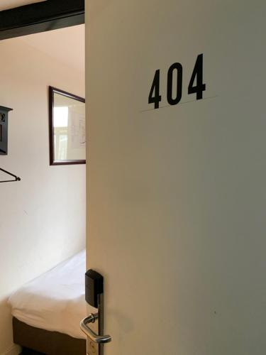 Postel nebo postele na pokoji v ubytování Hotel La Belle Vue
