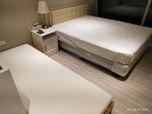 Postel nebo postele na pokoji v ubytování 想駐逢甲 Shine Residence