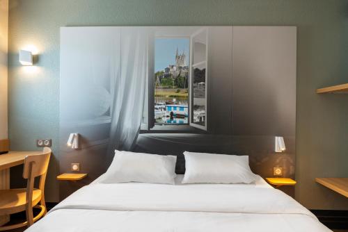 Postel nebo postele na pokoji v ubytování B&B HOTEL Angers 1 Beaucouzé