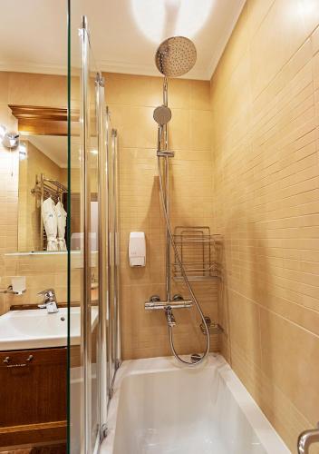 a bathroom with a shower and a sink at 7 Pools SPA Boutique Hotel in Bansko