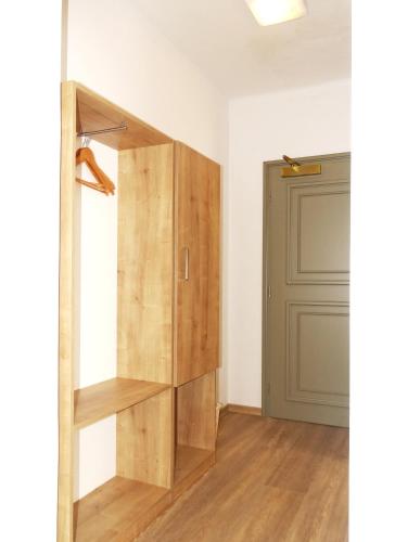 a closet in a room with a door at Hotel Garni Villa Areka in Český Krumlov