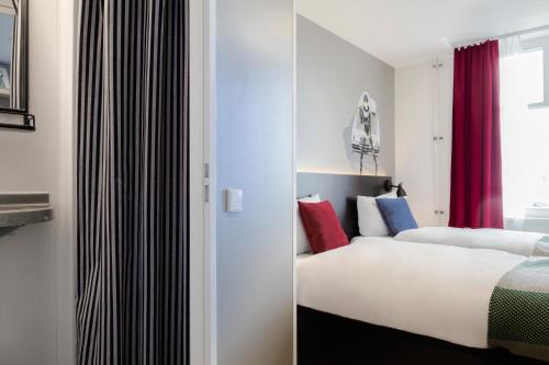 Una cama o camas en una habitación de Generator Hamburg