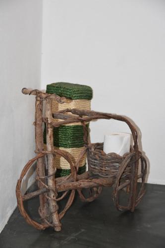 a basket of yarn and a candle on a table at Pousada Velho Bateau in Atins