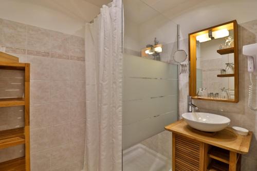 a bathroom with a sink and a shower at La Milane in Cabriès