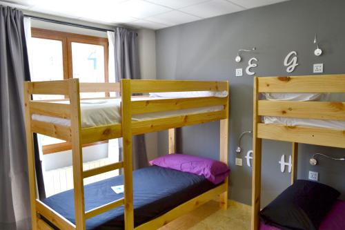 a bunk bed room with two bunk beds at Alda Estella Hostel in Estella