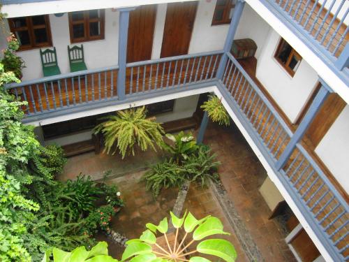 an overhead view of a building with stairs and plants at Hotel Doña Esther in Otavalo