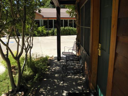 a couple of chairs sitting on the side of a building at Flanigan`s Resort and Spa in Springdale