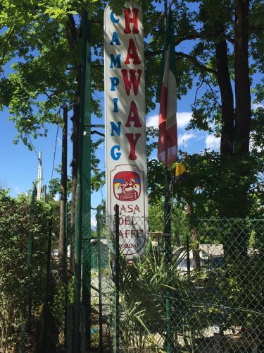 a banner on a fence with a sign on it at Campeggio Haway in Viverone