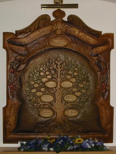 a wooden frame with a tree etched into it at Garni Haus Jagerwirt in Fuschl am See