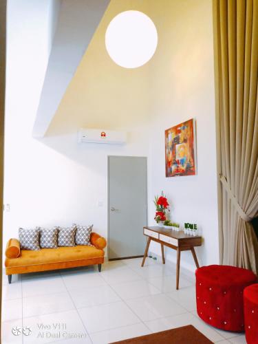 a living room with a couch and a table at Evo Bangi Duplex Homestay D' Imahzzz - 3BR or 2BR in Bangi