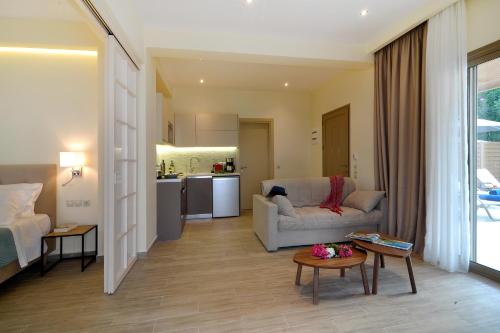 a living room with a couch and a table at Casa del Mar in Mpoukaris