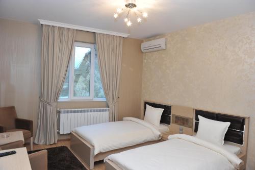 Ένα ή περισσότερα κρεβάτια σε δωμάτιο στο Eros Motel