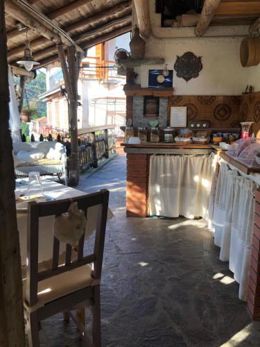 a room with a table and a chair in a store at Bed & Breakfast Lujocanda in Casarza Ligure