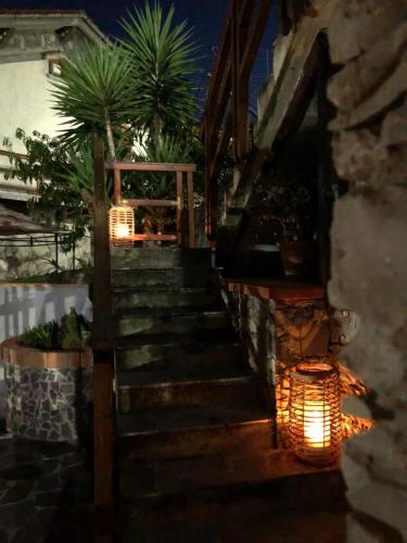 a set of stairs leading up to a house at night at Bed & Breakfast Lujocanda in Casarza Ligure